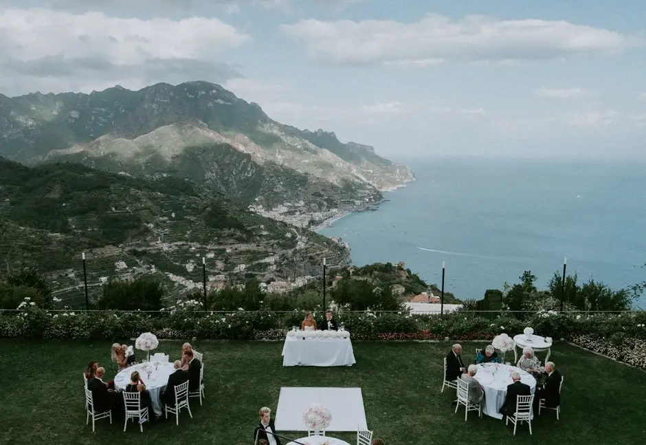 The reception tables set on the lawn above the Amalfi coastline