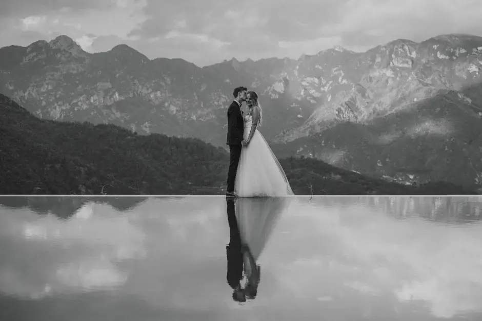 The two of them mirrored in the pool, black and white, Ravello