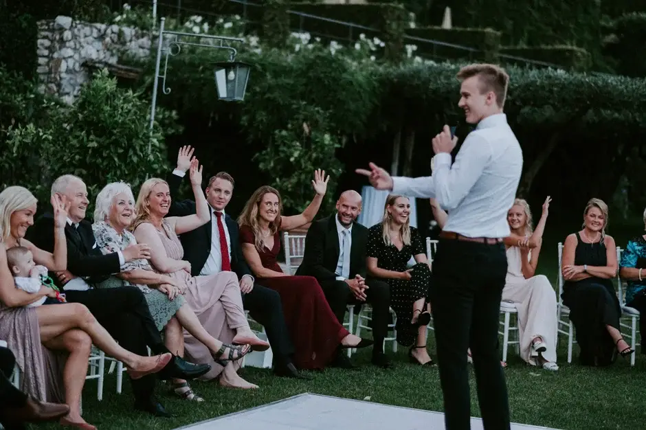 A guest giving a speech to laughing guests, Ravello
