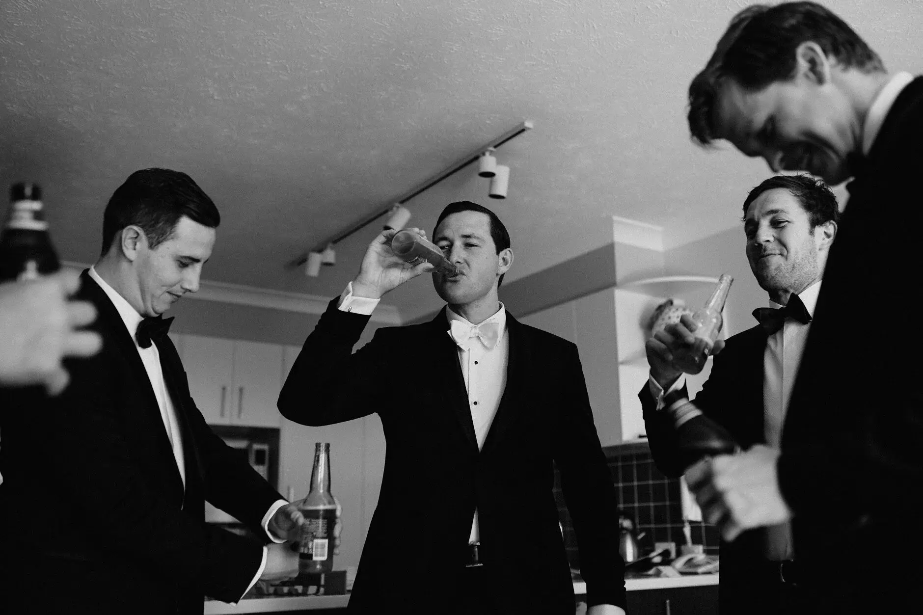 Groomsmen drinking and joking before the ceremony, Burleigh Heads