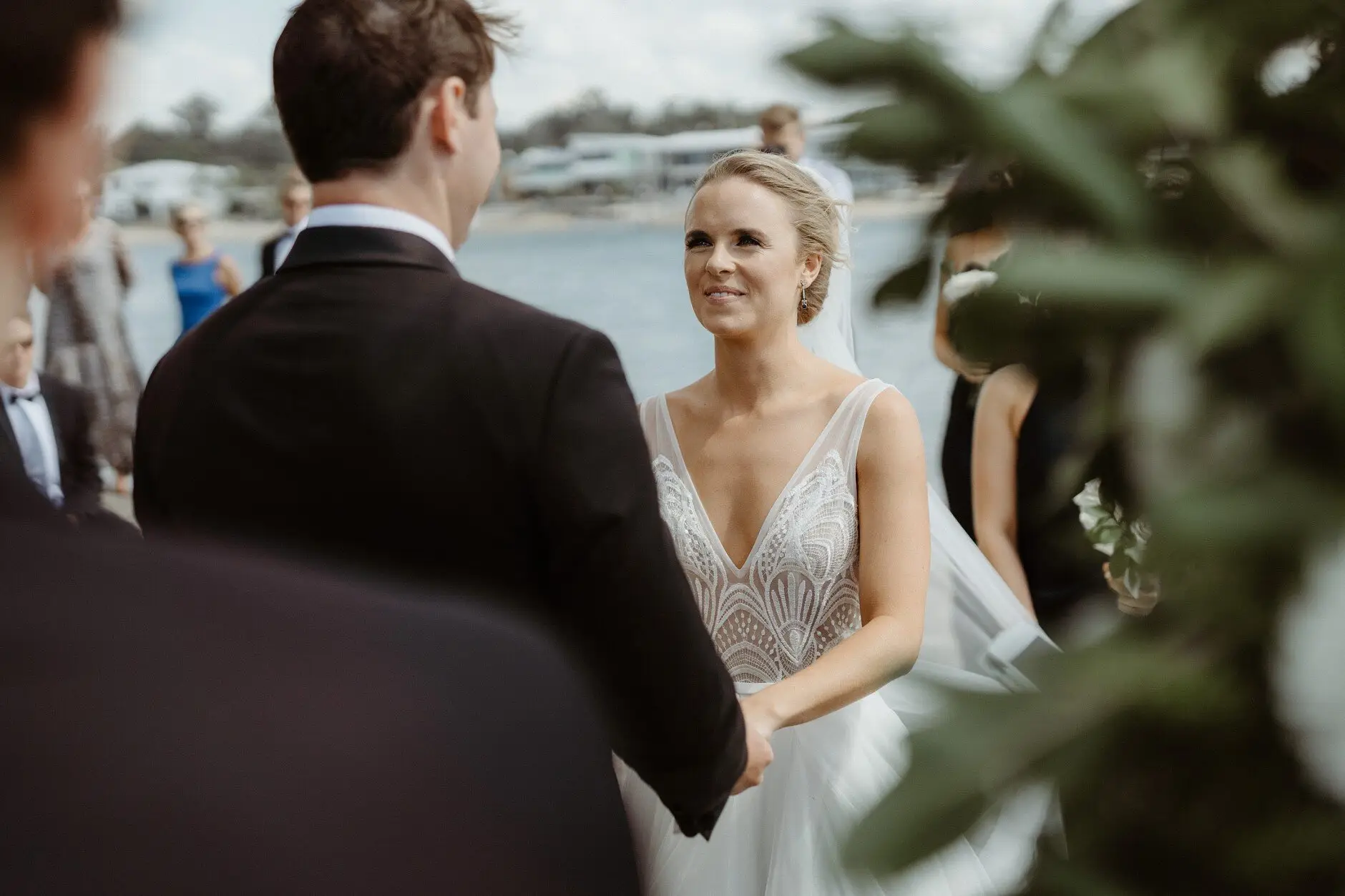 Clair and James holding hands during the ceremony, Burleigh Heads