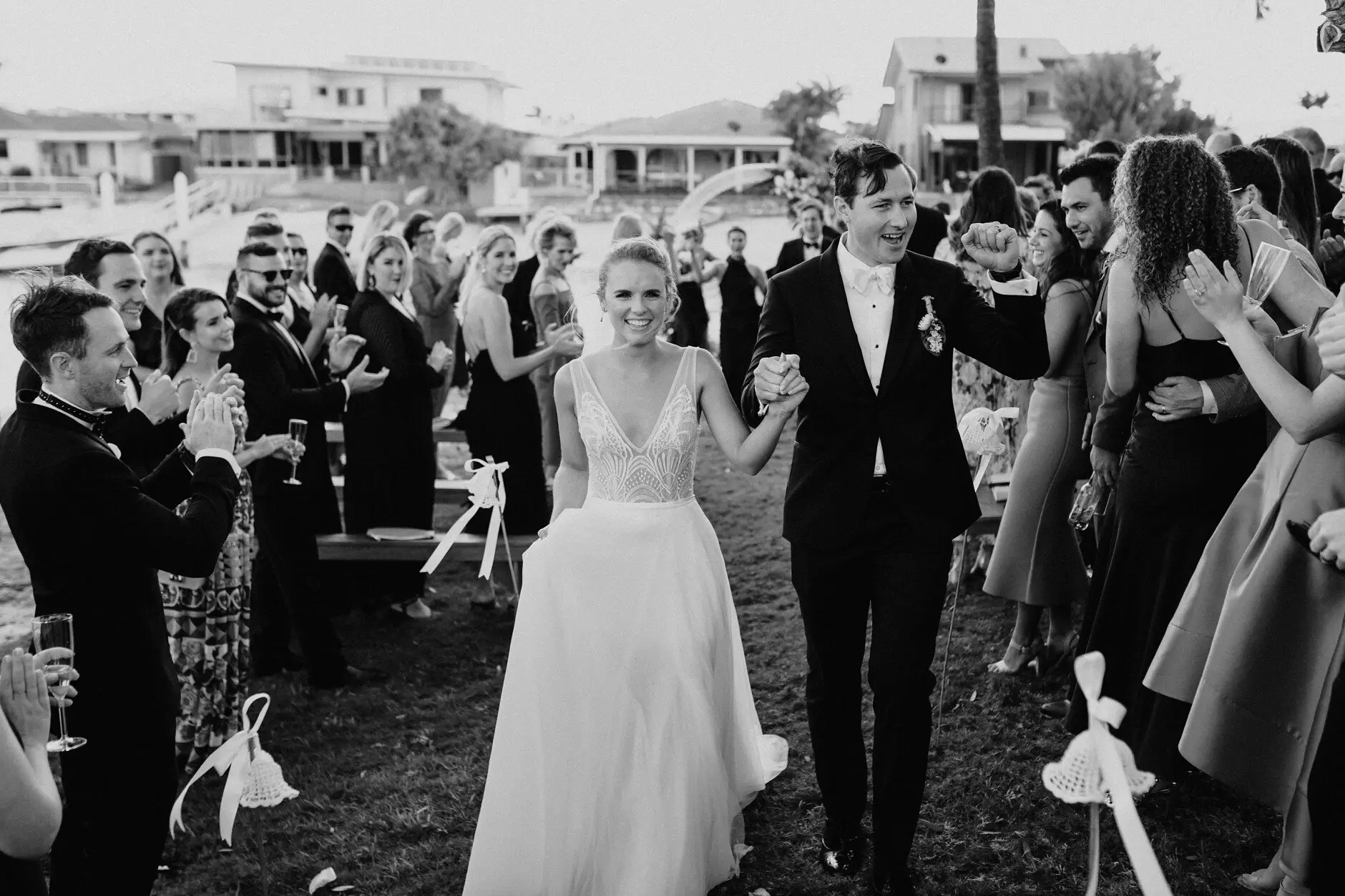 Clair and James walking out hand in hand after the ceremony