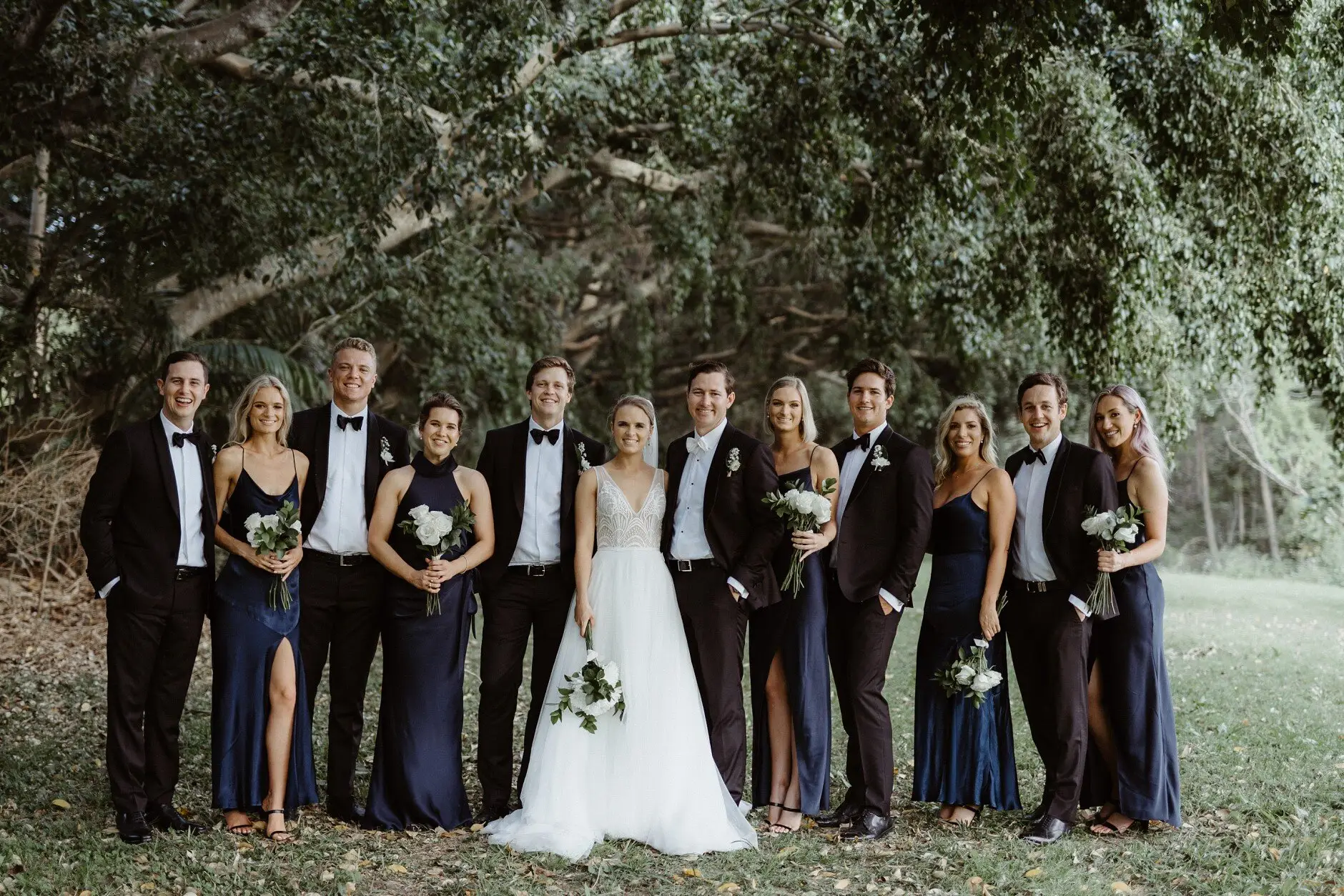 The full bridal party in the paperbark grove, Burleigh Heads
