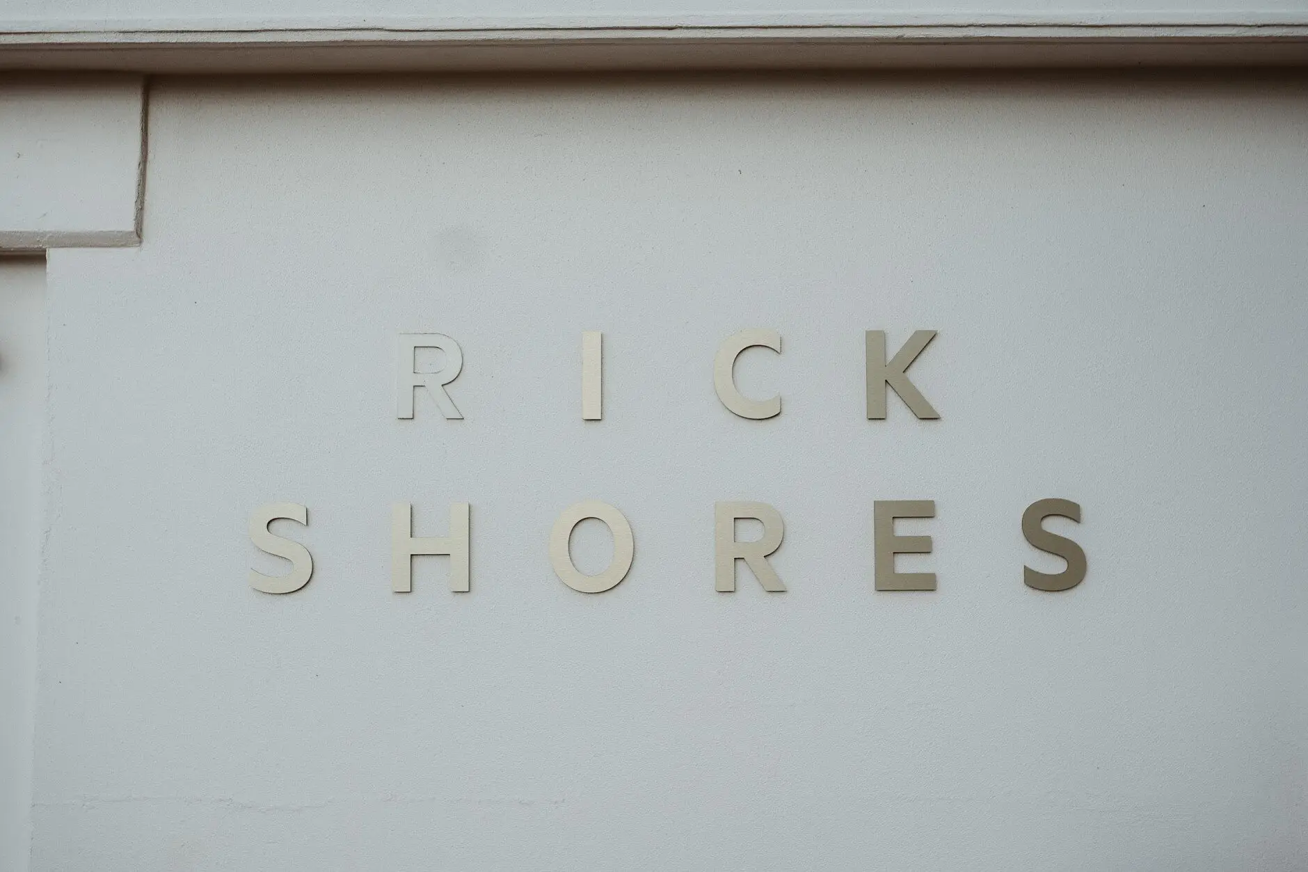 The Rick Shores sign on the wall at Burleigh Heads