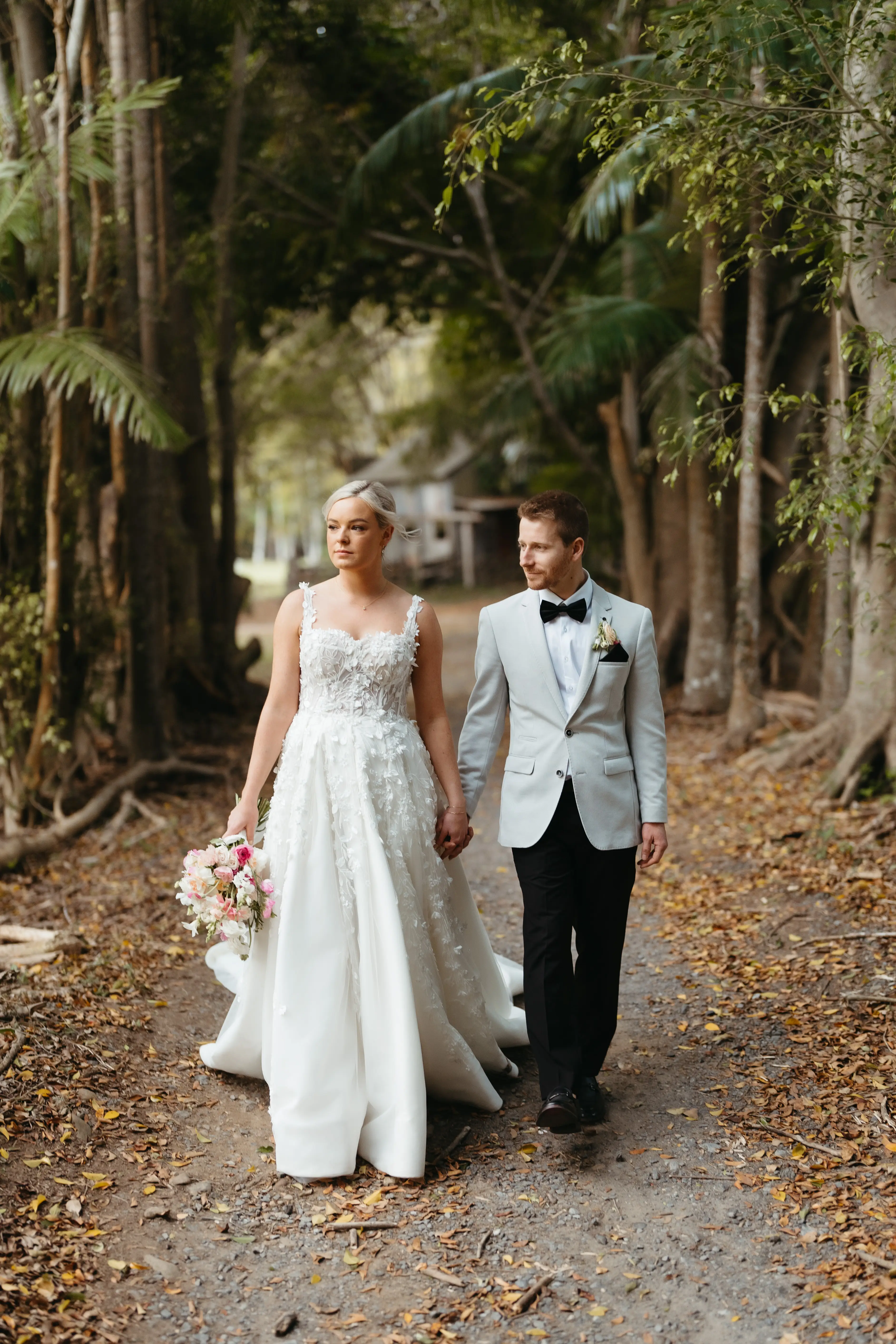 The couple walking the palm-lined path, The Acre Boomerang Hills