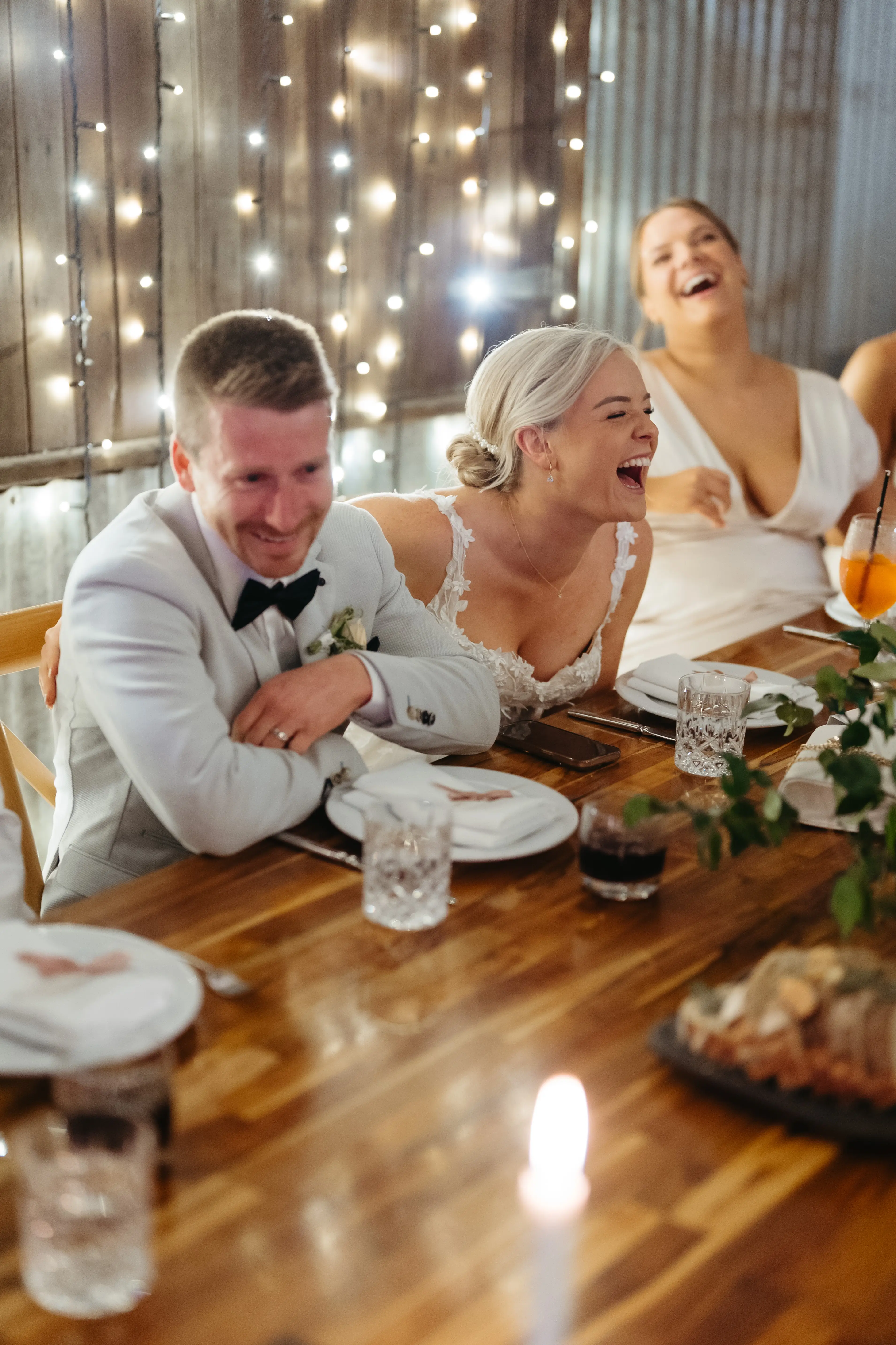 Laughter at the long tables under the barn’s fairy lights, The Acre Boomerang Hills