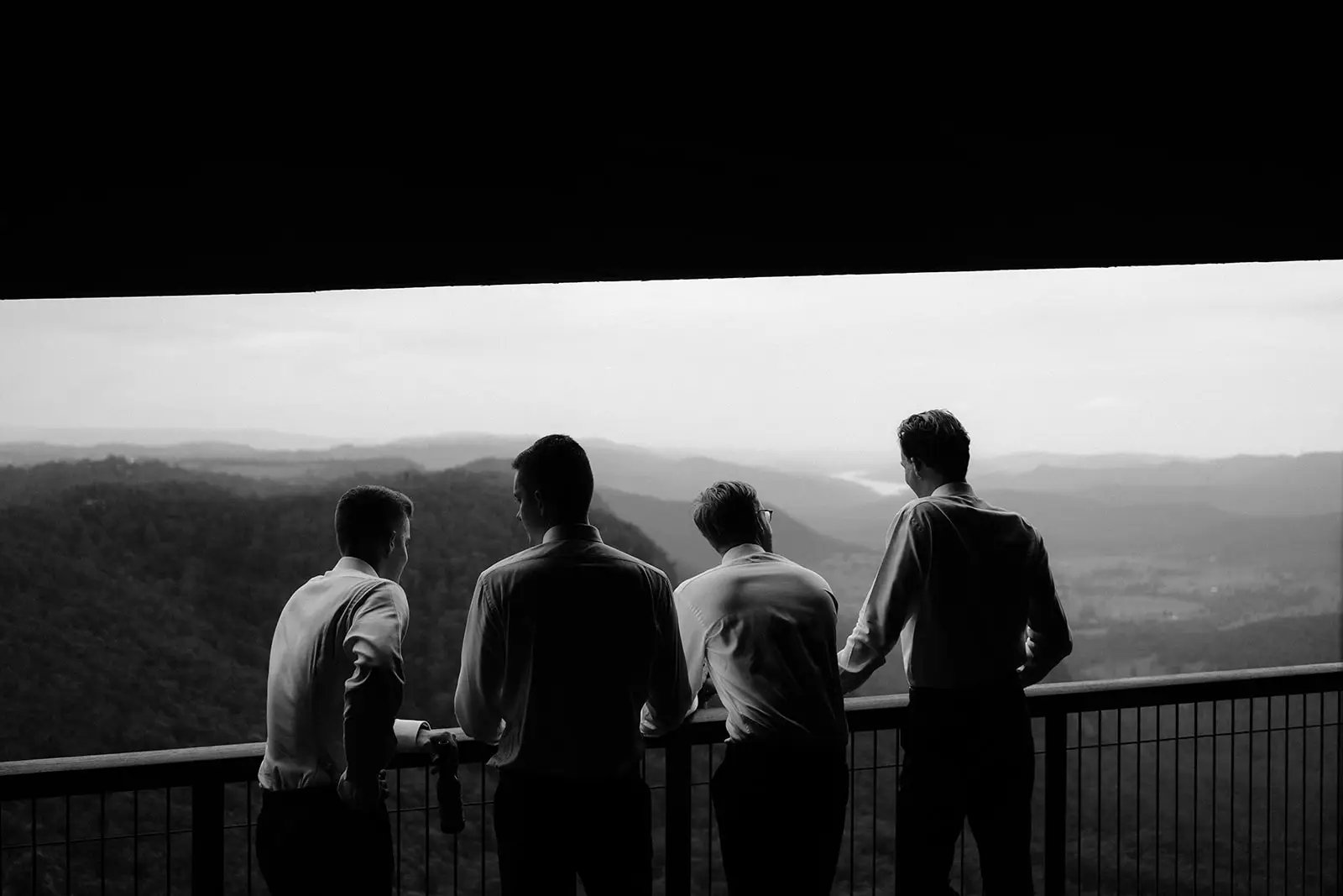 The groomsmen looking out over the valley from the homestead verandah, Rosewood Estate