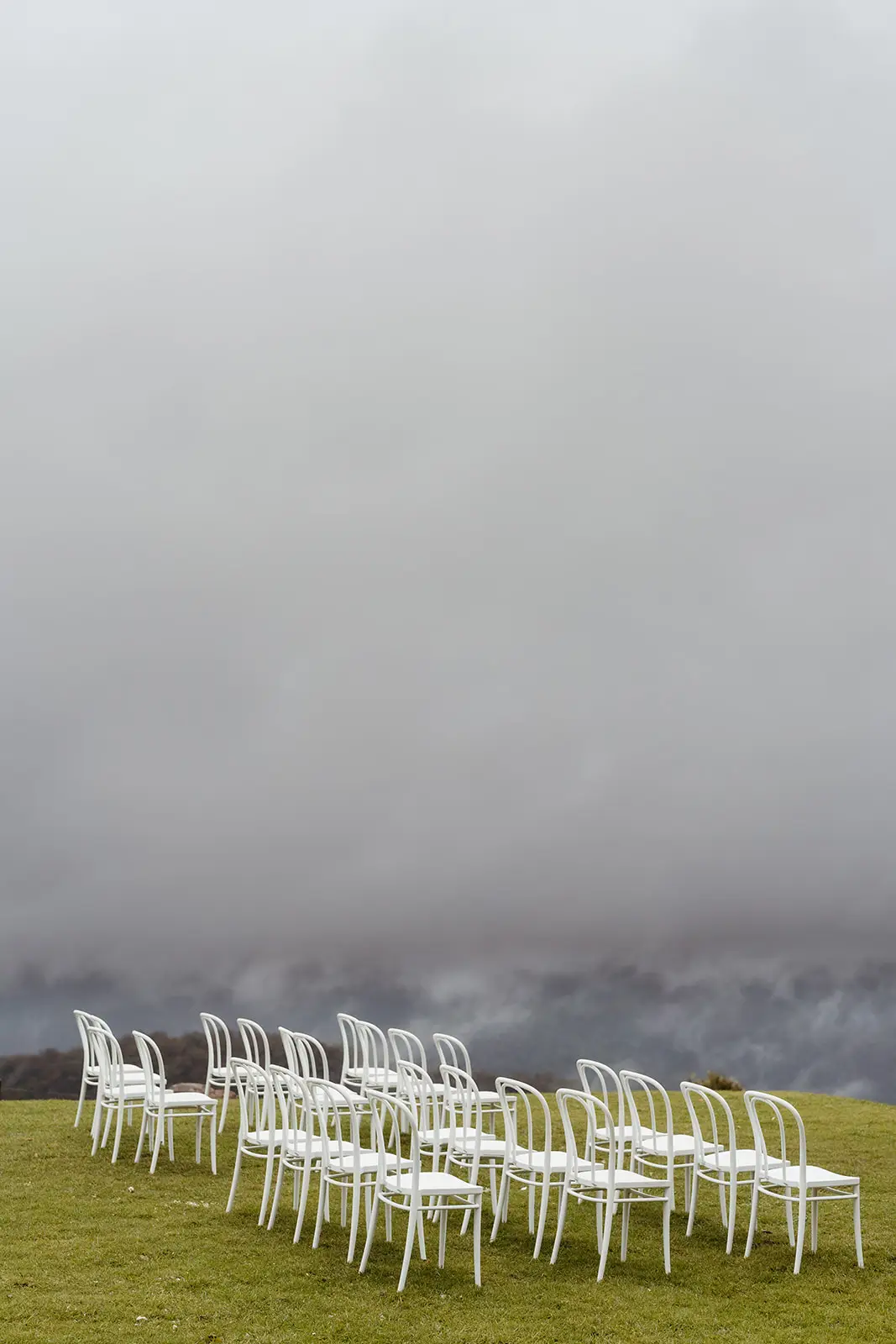 White chairs set out on the lawn as fog rolls in, Rosewood Estate