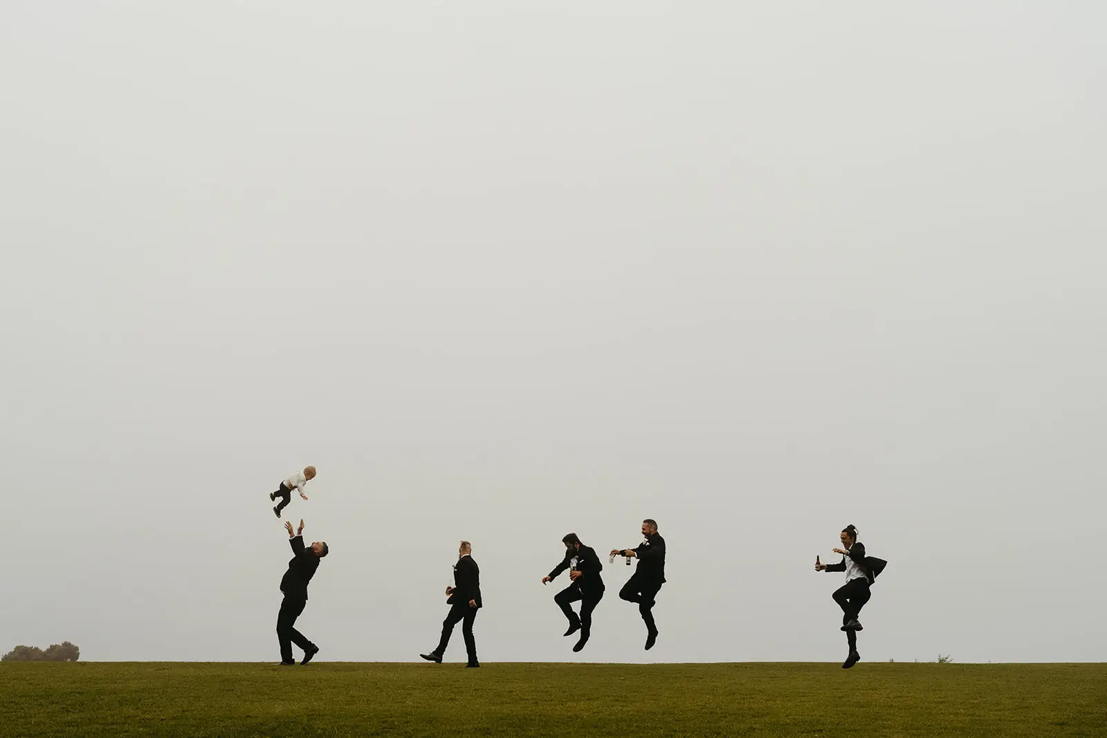 The wedding party mucking about on the ridge in the fog, Rosewood Estate