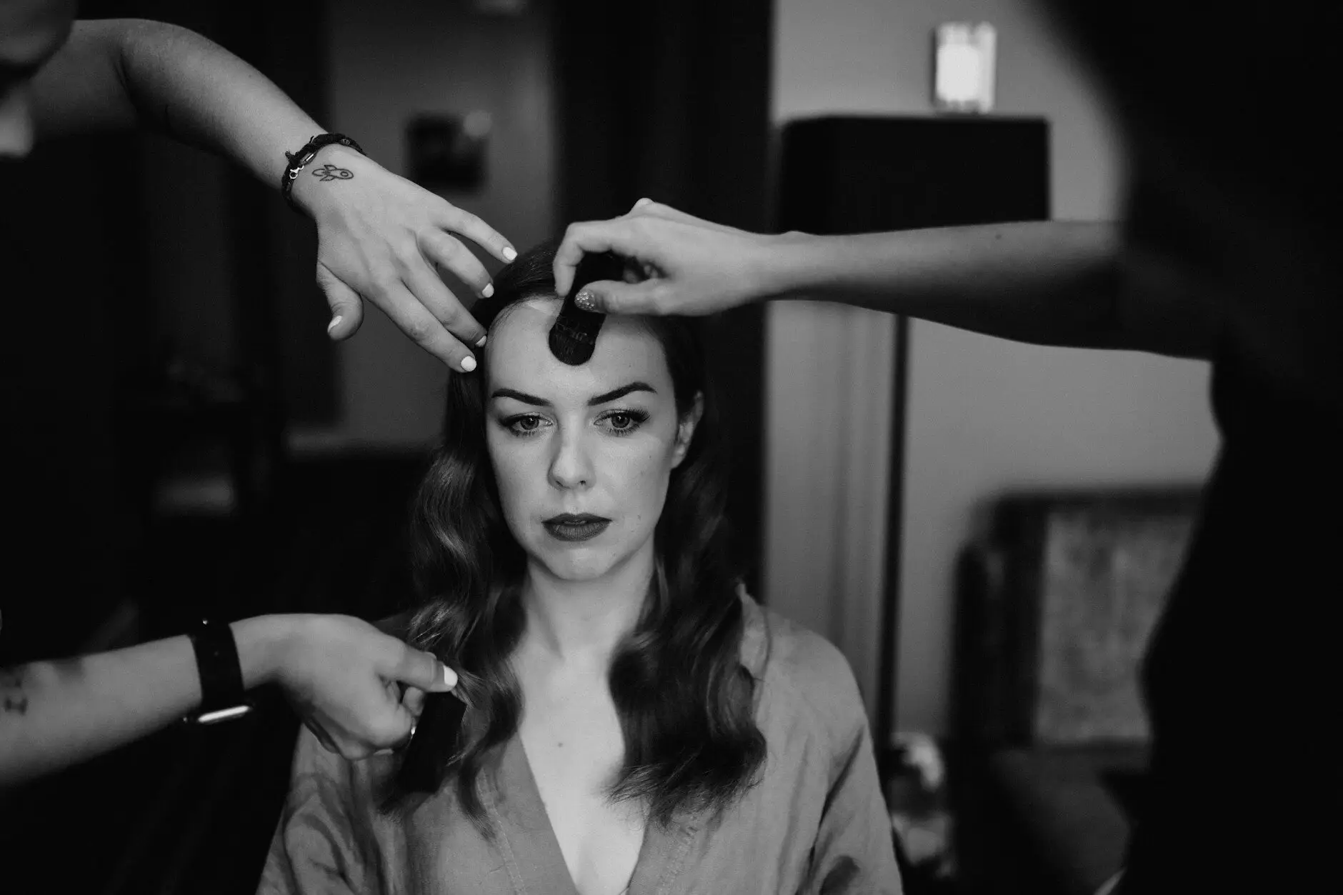 Sophie having her hair pinned, in black and white, Sydney