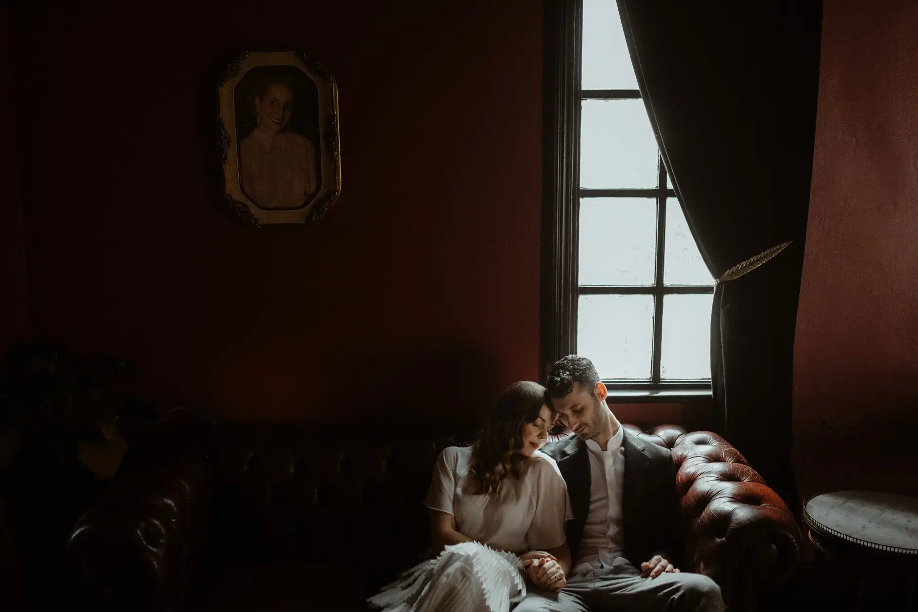 The couple on the chesterfield by the window in the red upstairs room, Casa, Surry Hills
