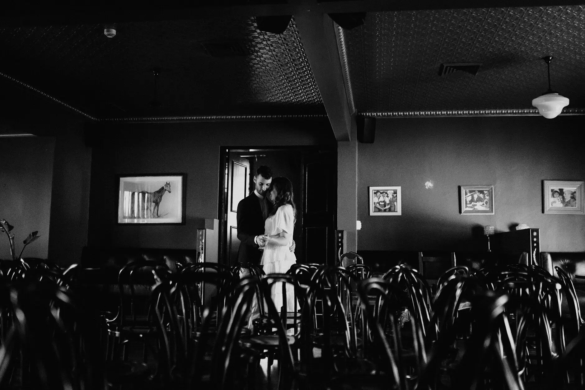 The dark room, the chairs, and the couple far off by the window, Casa, Surry Hills