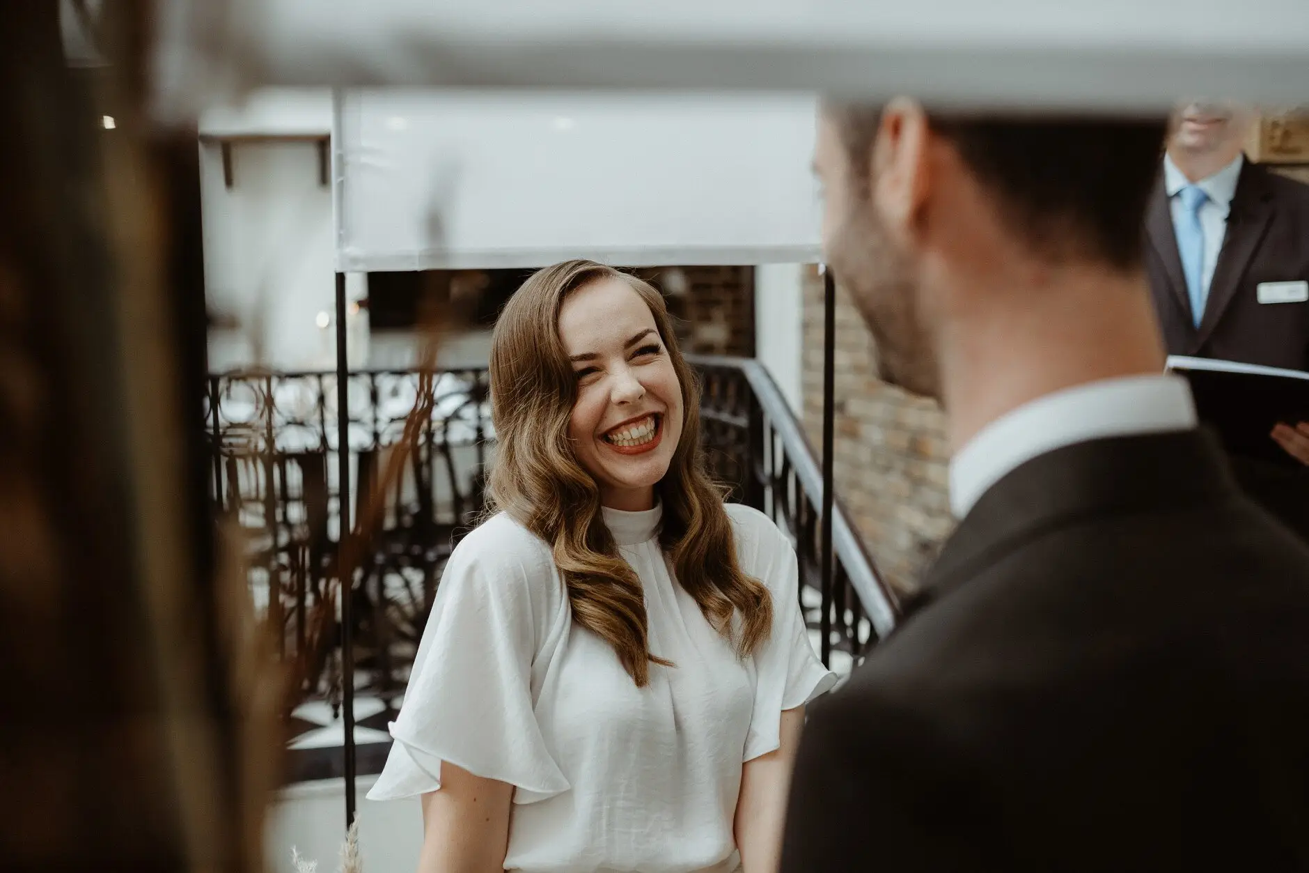Sophie laughing with a guest under the brick arches, Porteño, Surry Hills