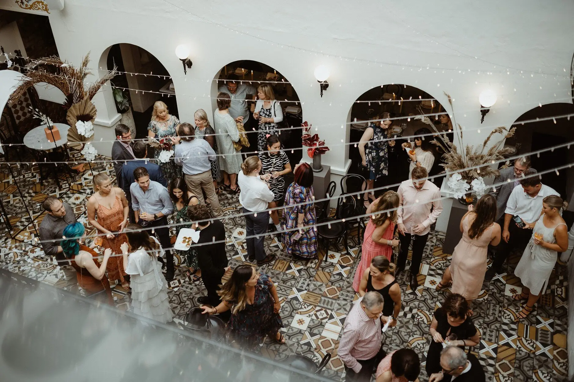 The confetti-strewn room full of guests celebrating, Porteño, Surry Hills