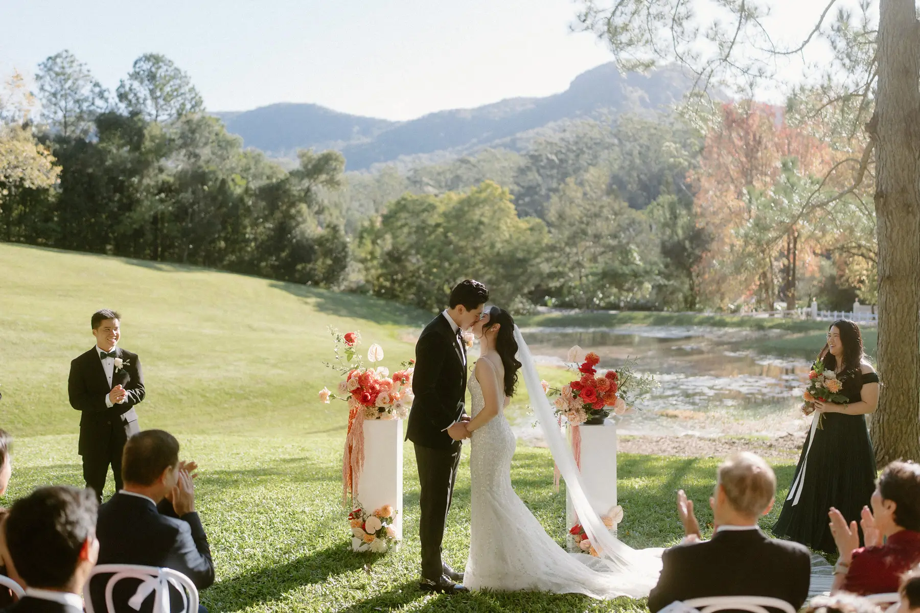 The kiss, with the autumn trees and the ridge line behind them, Tall Trees Tallebudgera Valley