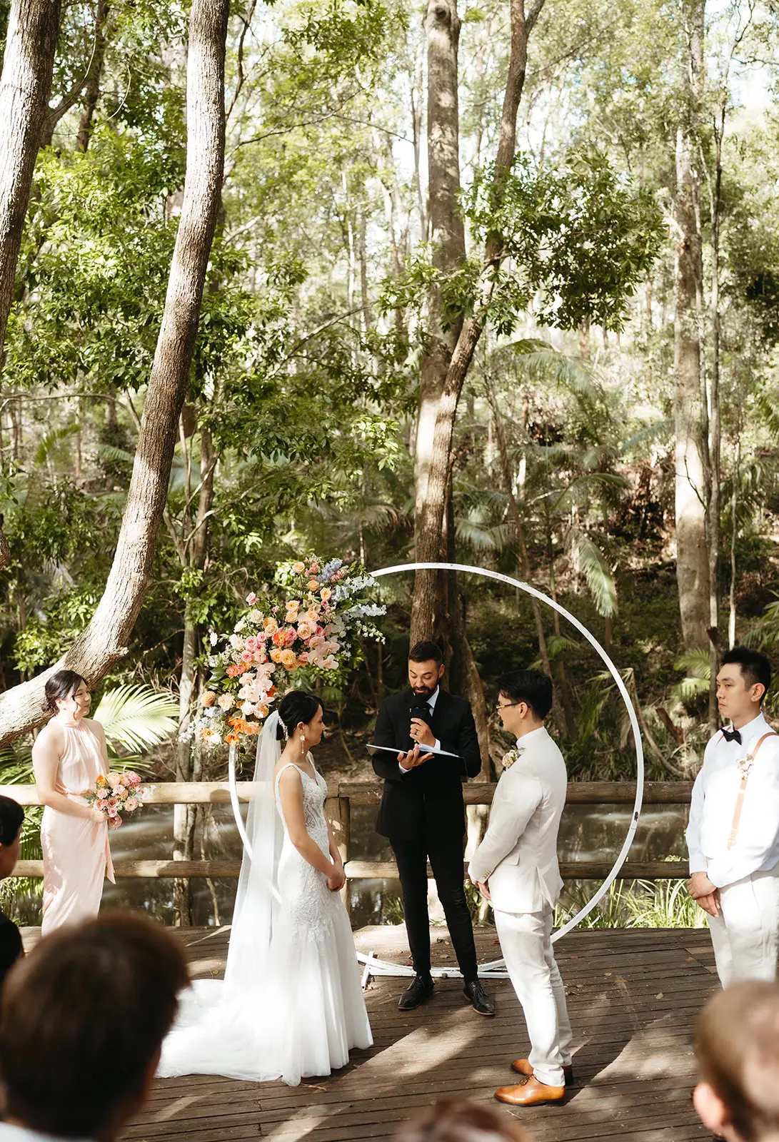 Vows on the Rainforest Deck — the circle arch and the creek behind, The Acre Boomerang Hills