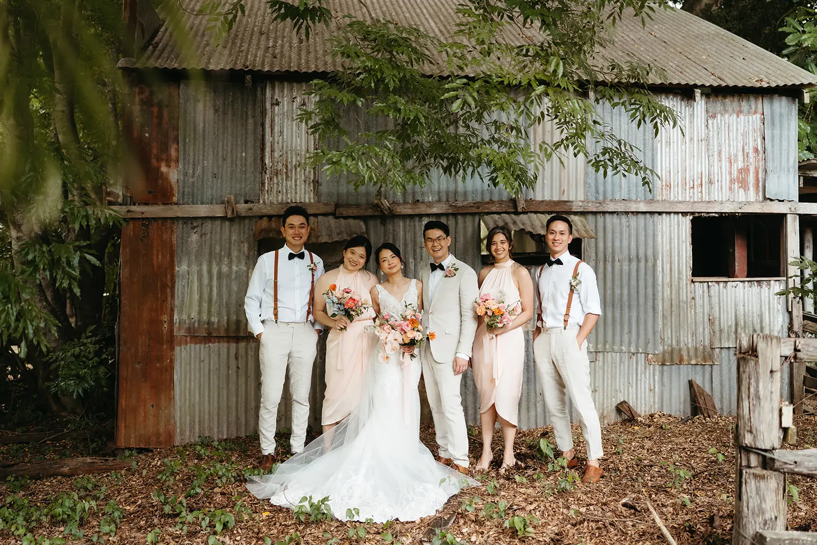 The wedding party against the old corrugated-iron shed, The Acre Boomerang Hills