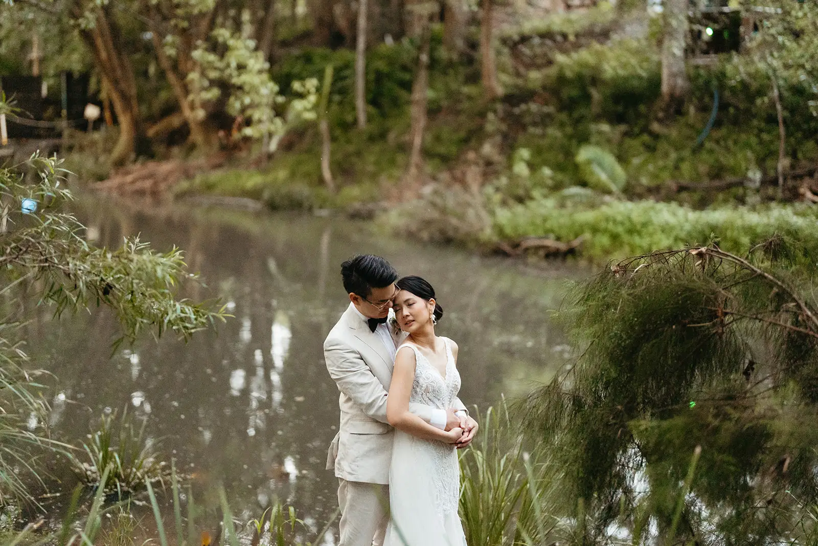 The couple beside the creek, rainforest all around, The Acre Boomerang Hills