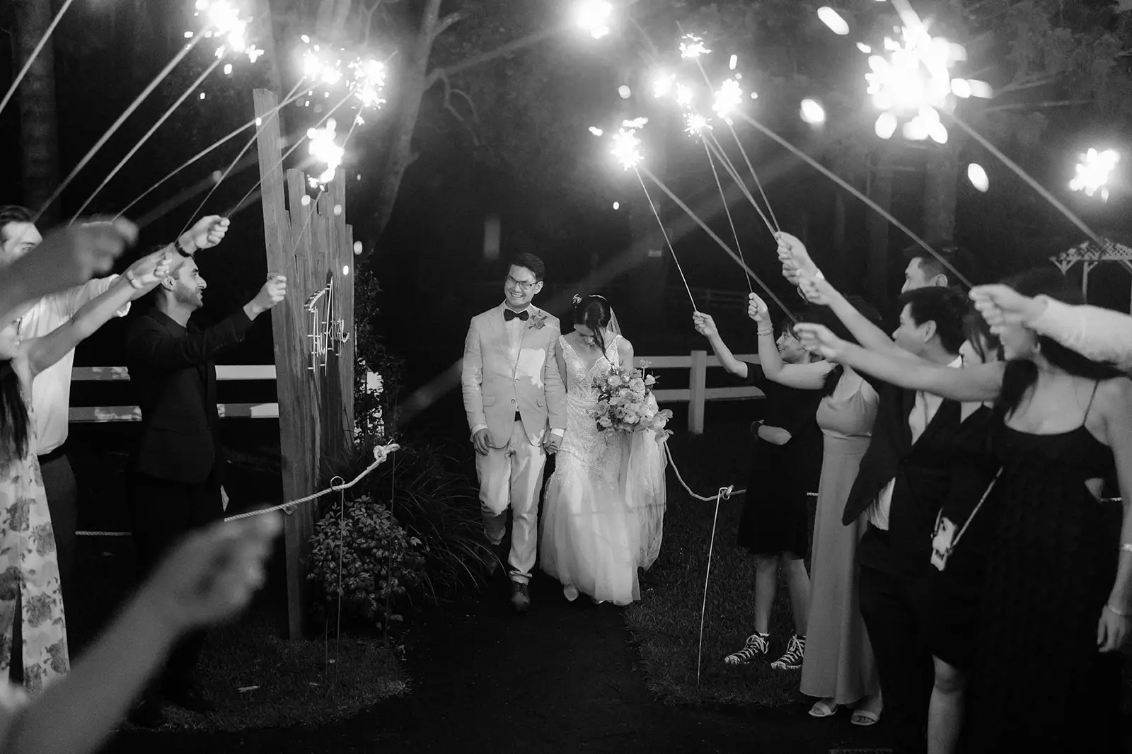 Sparklers overhead as the couple arrive into the reception, The Acre Boomerang Hills